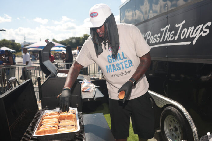 Chef Way behind the grill during Kingsford’s Pass the Tongs activation at the Atlanta Greek Picnic.